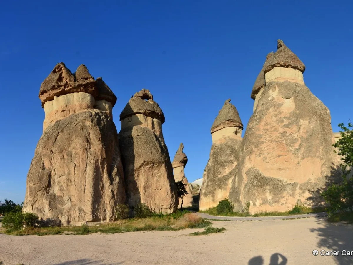 Pasabag rock formations beneath a blue sky in Cappadocia