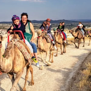 family camel ride Cappadocia, outdoor adventure, scenic camel safari, Cappadocia family activities, unique travel experiences