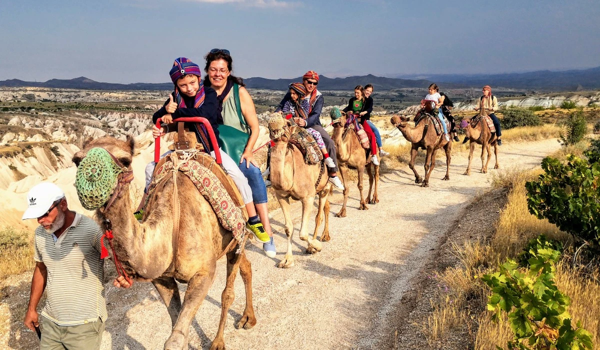 family camel ride Cappadocia, outdoor adventure, scenic camel safari, Cappadocia family activities, unique travel experiences