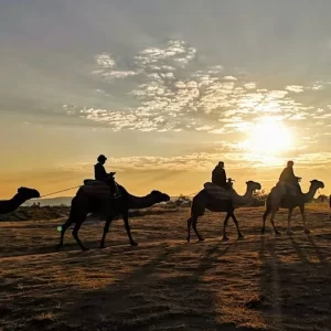 sunset camel safari Cappadocia, scenic adventure, golden hour experience, Cappadocia camel tour, unforgettable travel moments
