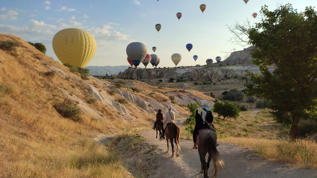 Cappadocia horseback tours with balloons, sunrise riding experiences, hot air balloon valley rides, scenic trails in Cappadocia, outdoor adventures with balloons