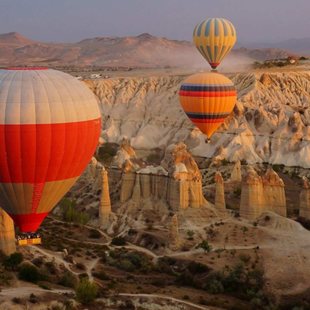 Private hot air balloon flight, Cappadocia fairy chimneys, exclusive balloon ride Turkey, luxury aerial tour, personalized Cappadocia experience