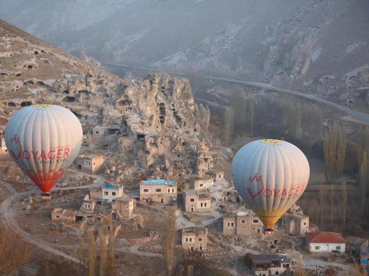 Hot air balloons above Soganli village and canyon in Cappadocia