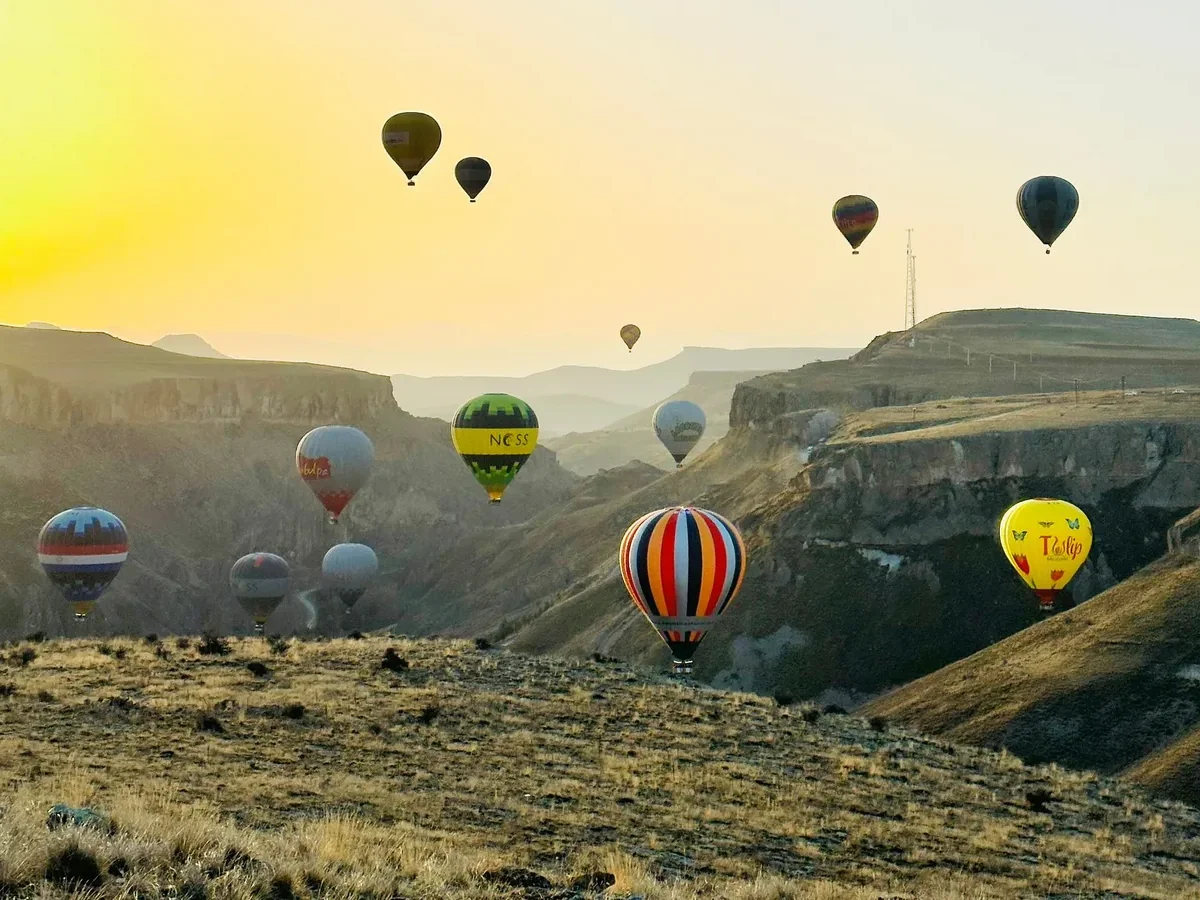 Sunrise balloon flight over Soganli Valley landscape in Cappadocia