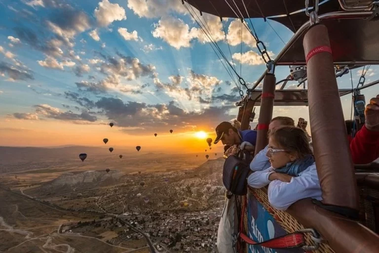 Cappadocia hot air balloon experience, sunrise views, balloon flight Turkey, aerial adventure, scenic Cappadocia ride