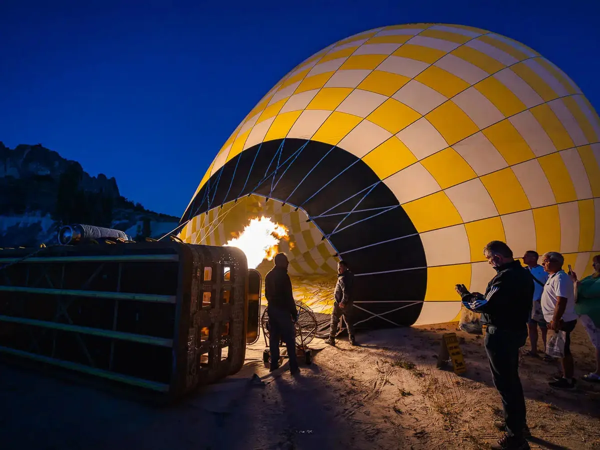 Hot air balloon inflation under the Cappadocia morning sky