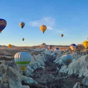 Beautiful hot air balloons floating over Göreme rock valley