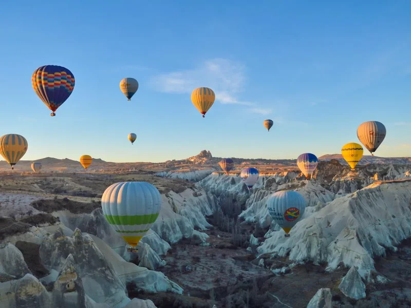 Beautiful hot air balloons floating over Göreme rock valley