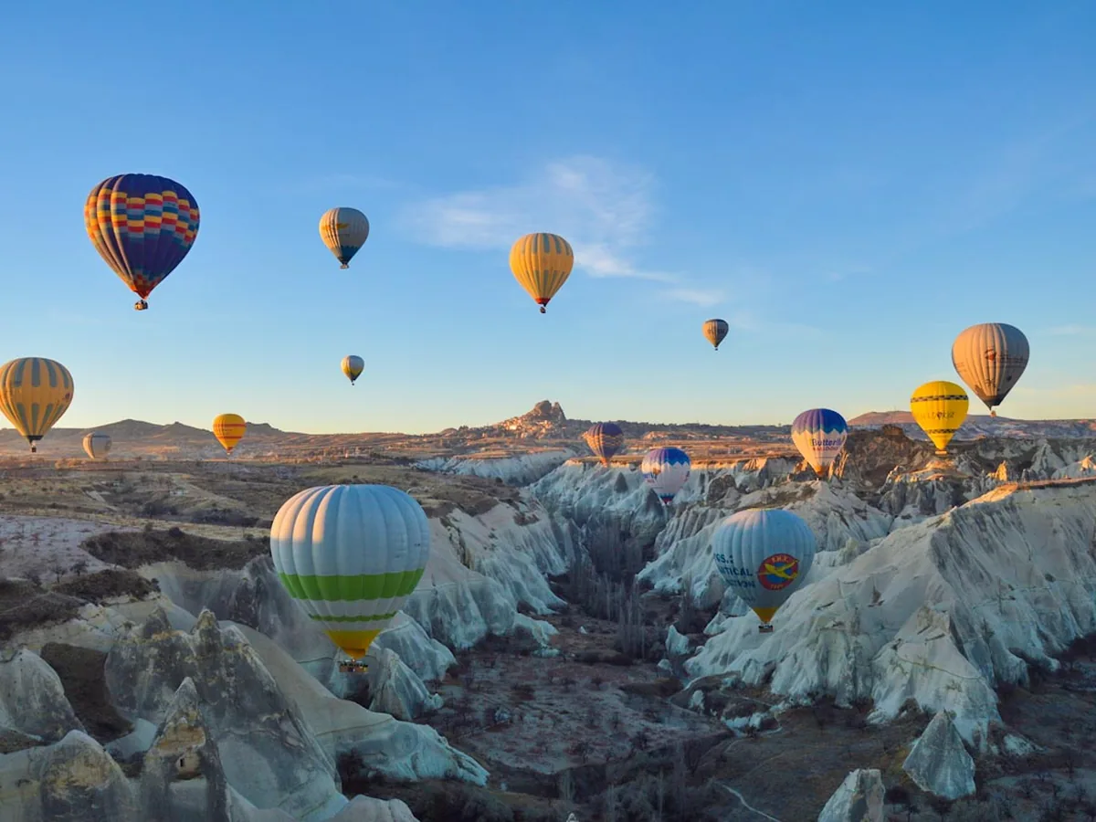 Beautiful hot air balloons floating over Göreme rock valley