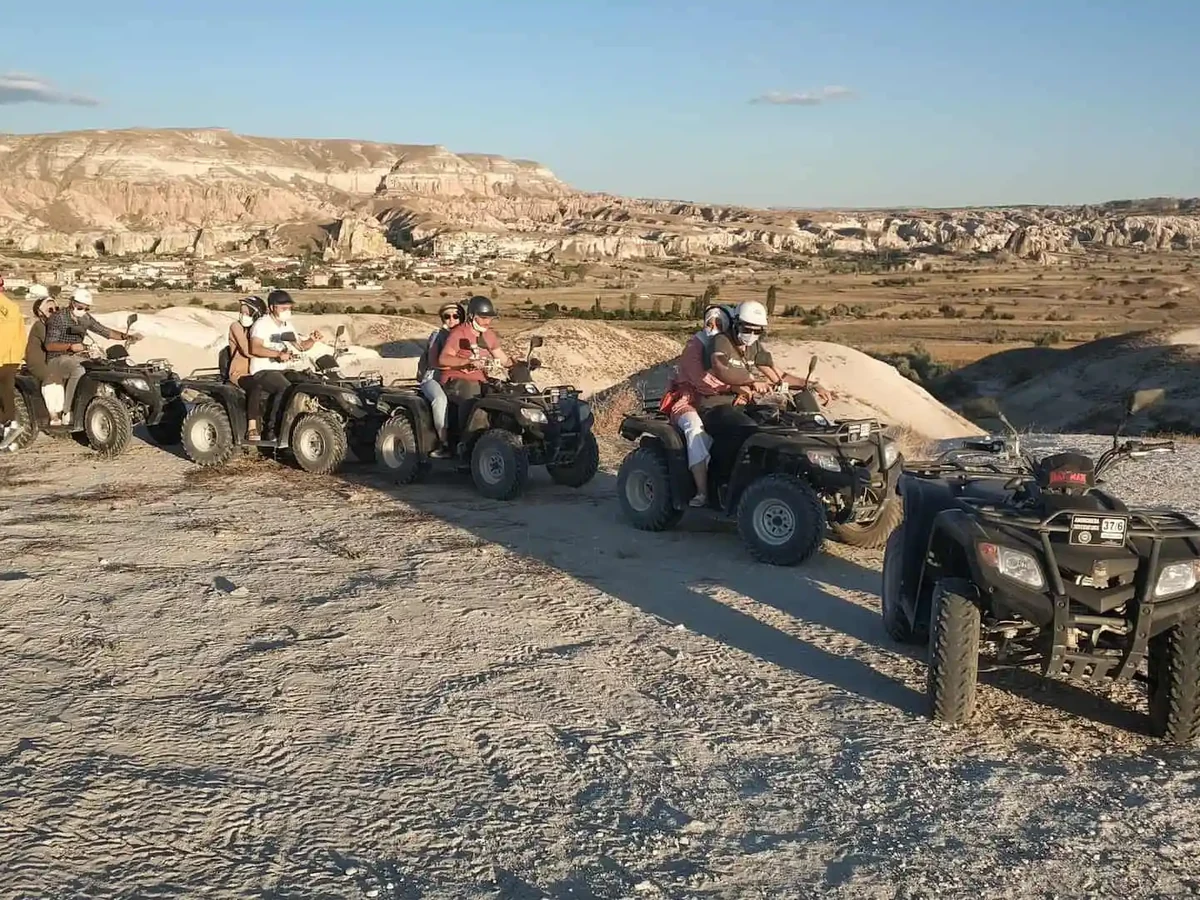 Daytime ATV tour group taking a photo break in Cappadocia