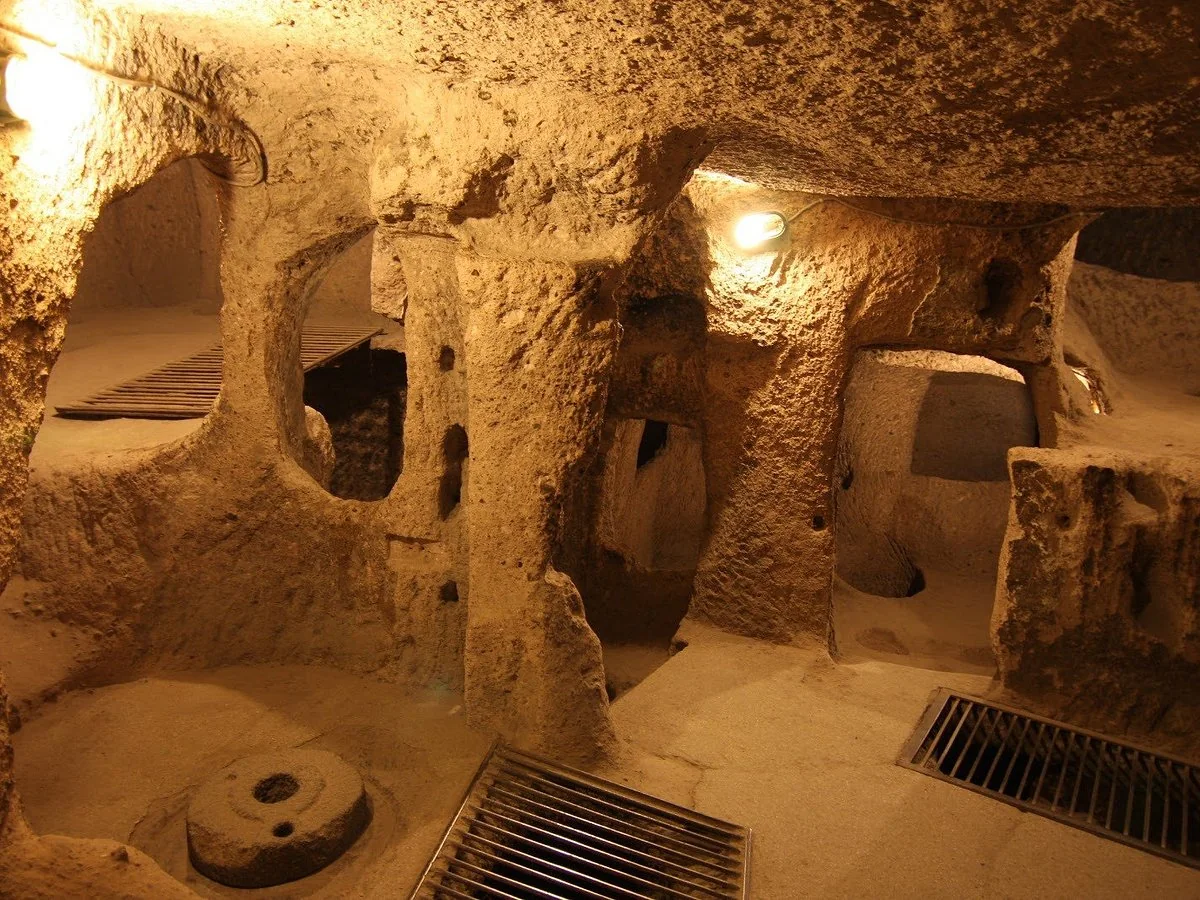 Tour guide explaining a Cappadocia underground city