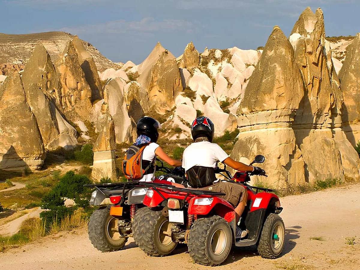 Two quad bikes overlooking Cappadocia rock formations on a valley tour