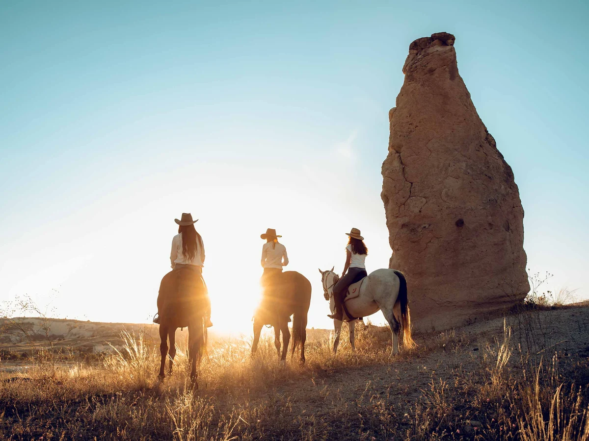 Sunrise horse riding experience among the rock formations of Cappadocia