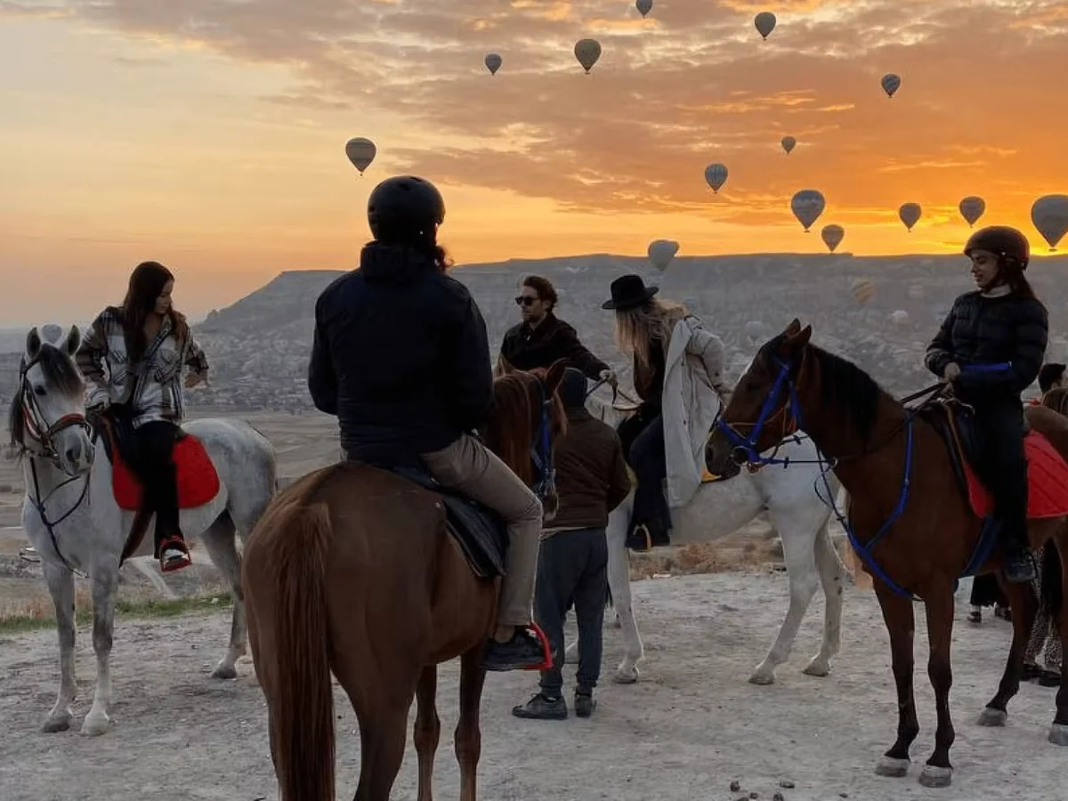 Guided horse tour through Cappadocia valleys during sunrise