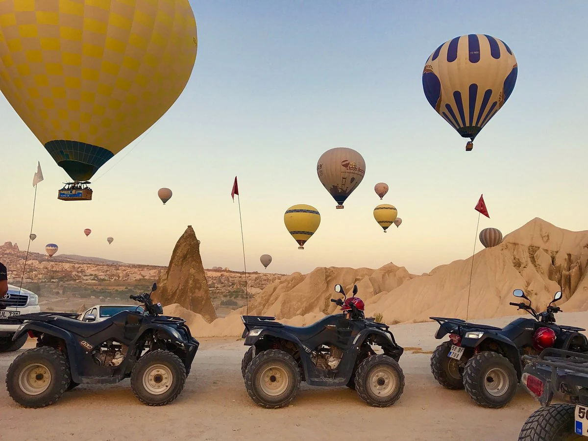Quad bikes ready for a sunrise tour in Cappadocia with hot air balloons
