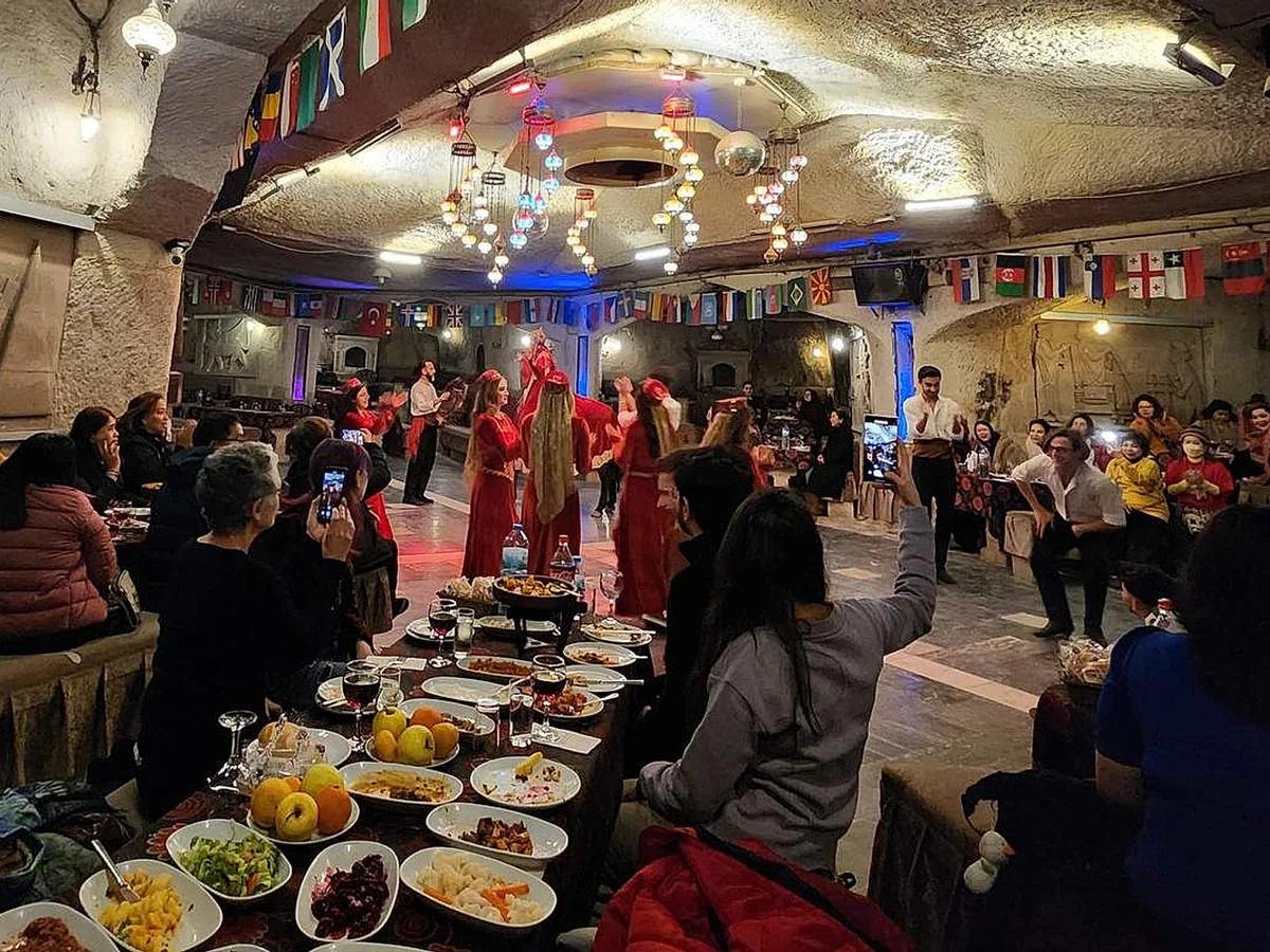 Guests watching a traditional dance during a Turkish Night dinner in Cappadocia