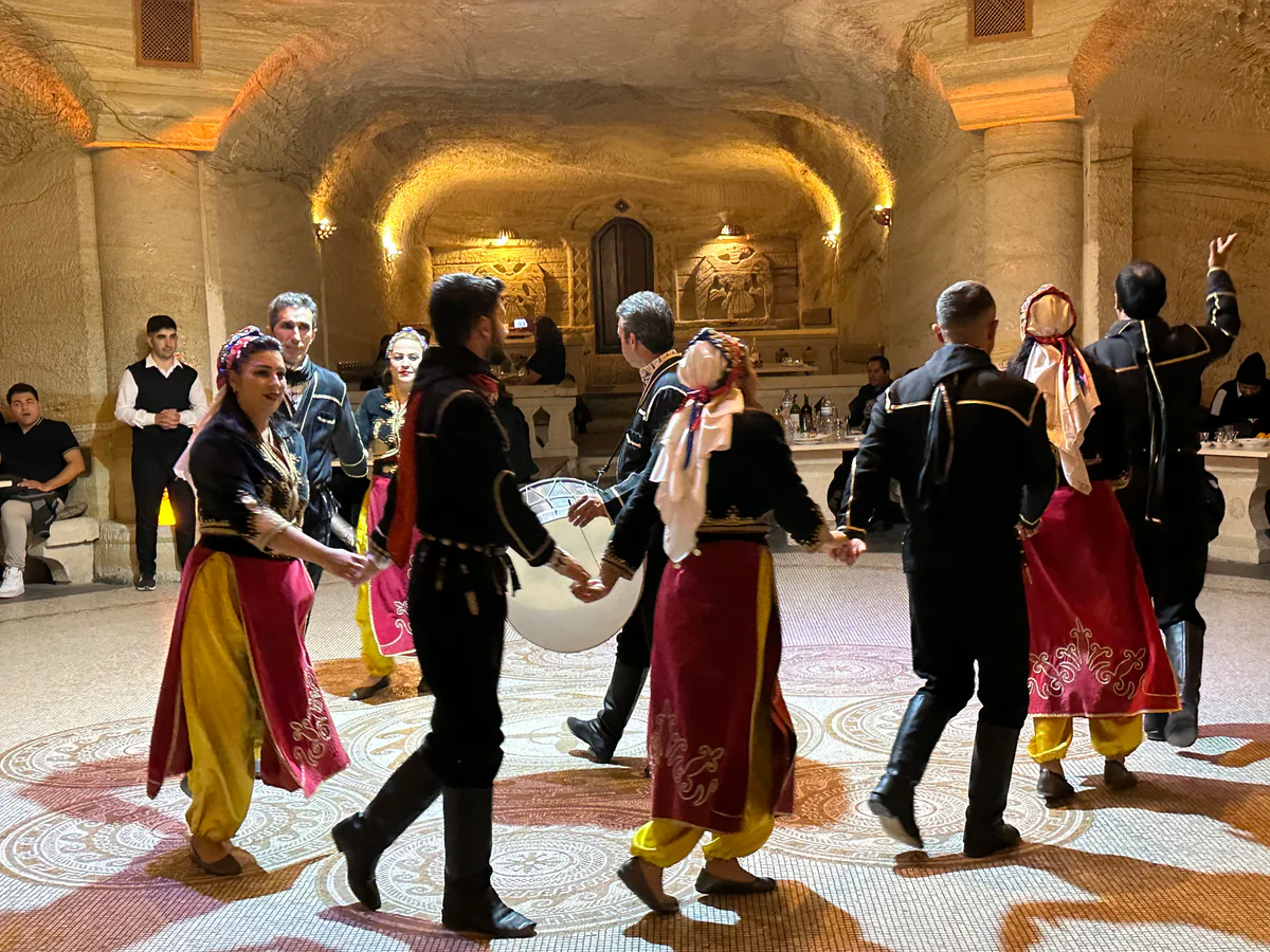 Traditional dancers performing during a Cappadocia Turkish Night dinner show
