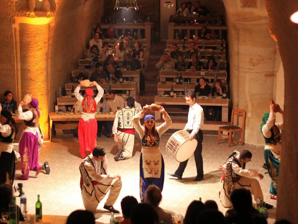 Traditional dancers performing on stage at a Turkish Night Show in Cappadocia