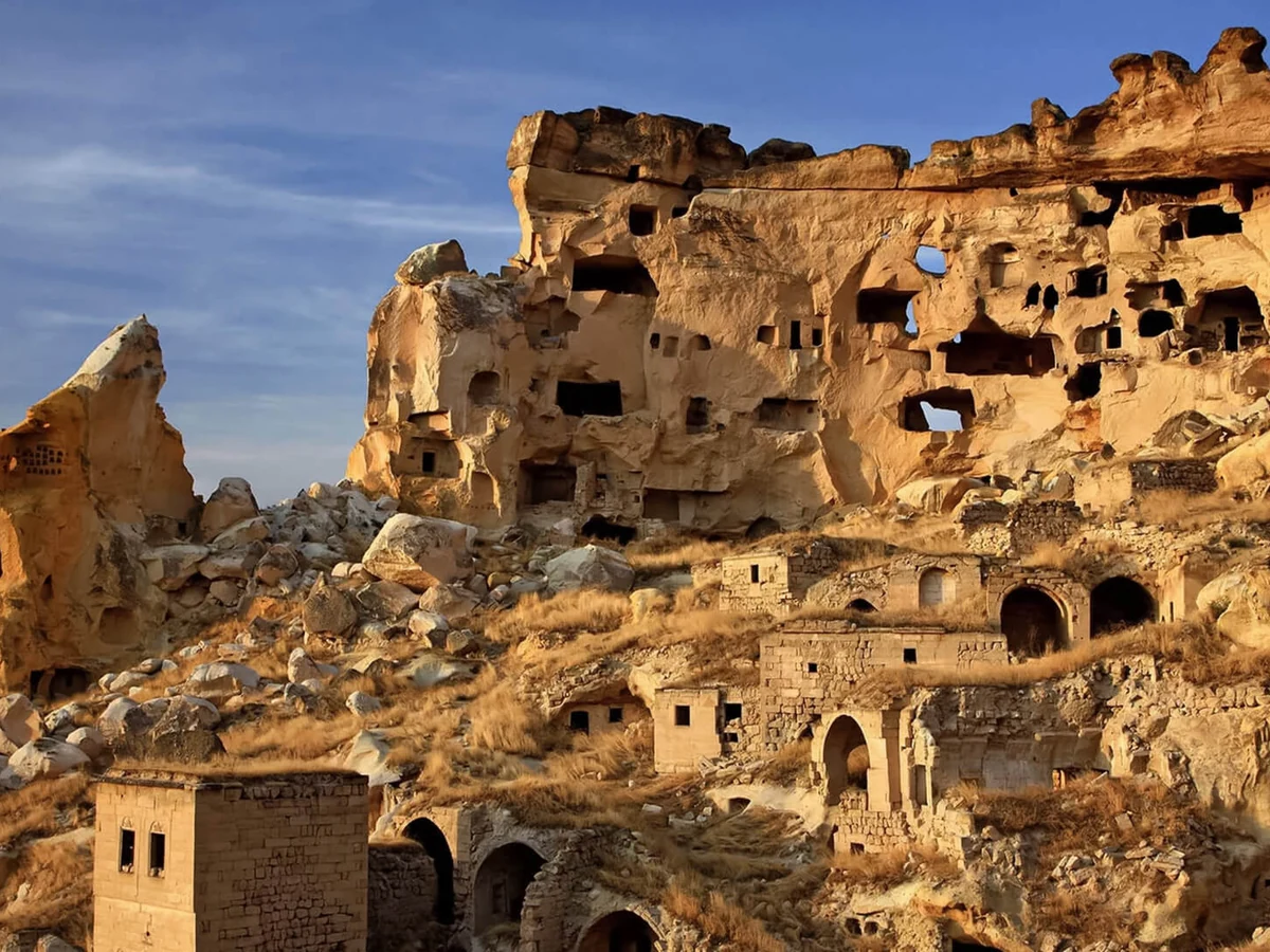 Historic cave homes at Cavusin Old Greek Village on a private Cappadocia Red Tour