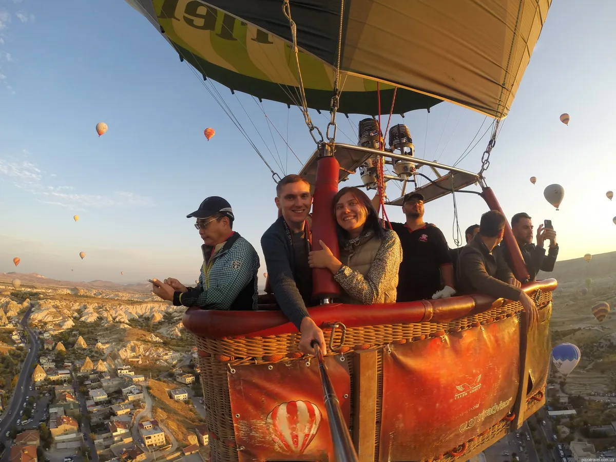 Couple enjoying the Cappadocia sunrise from a hot air balloon basket