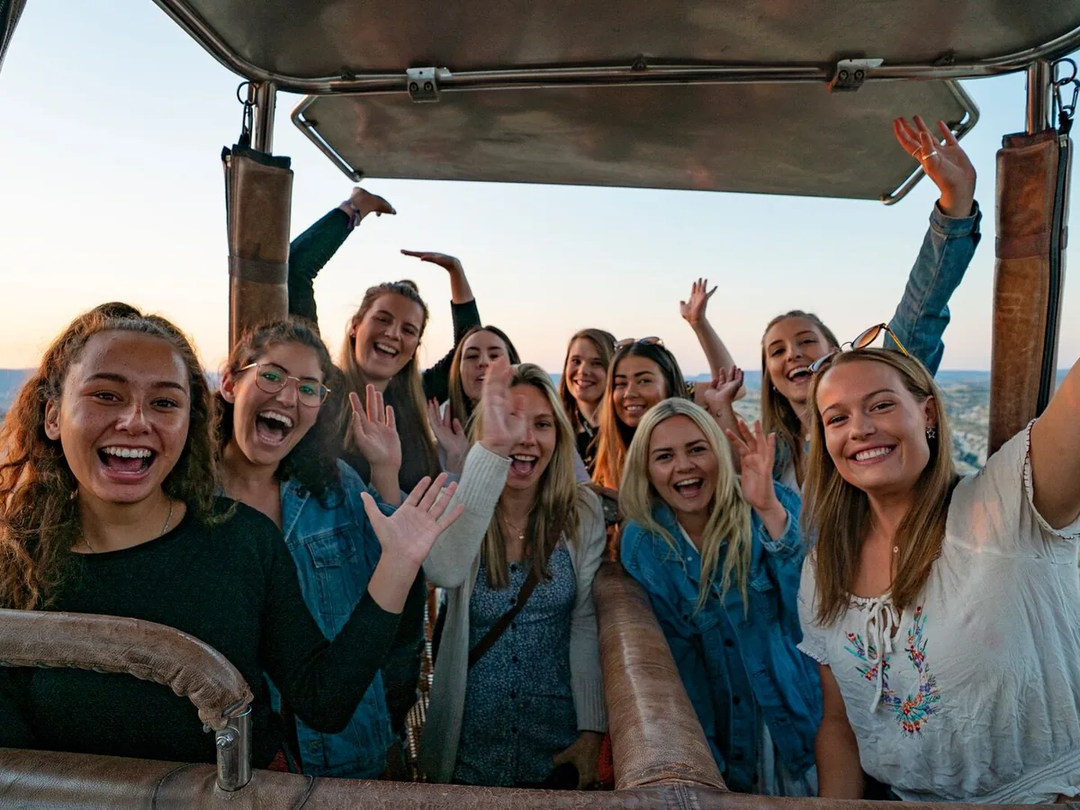 Friends celebrating together in Cappadocia hot air balloon basket