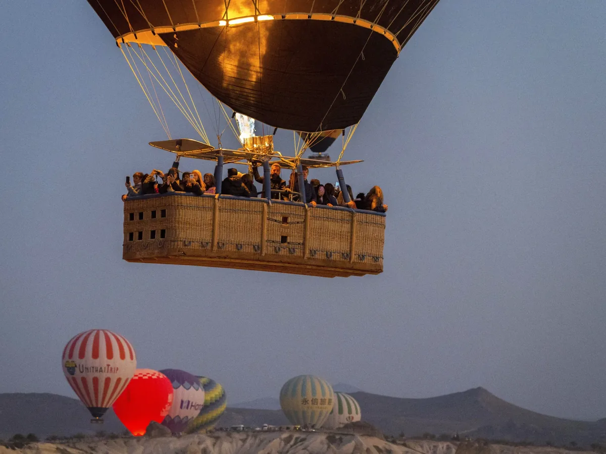 Hot air balloon flight in flight at dawn in Cappadocia