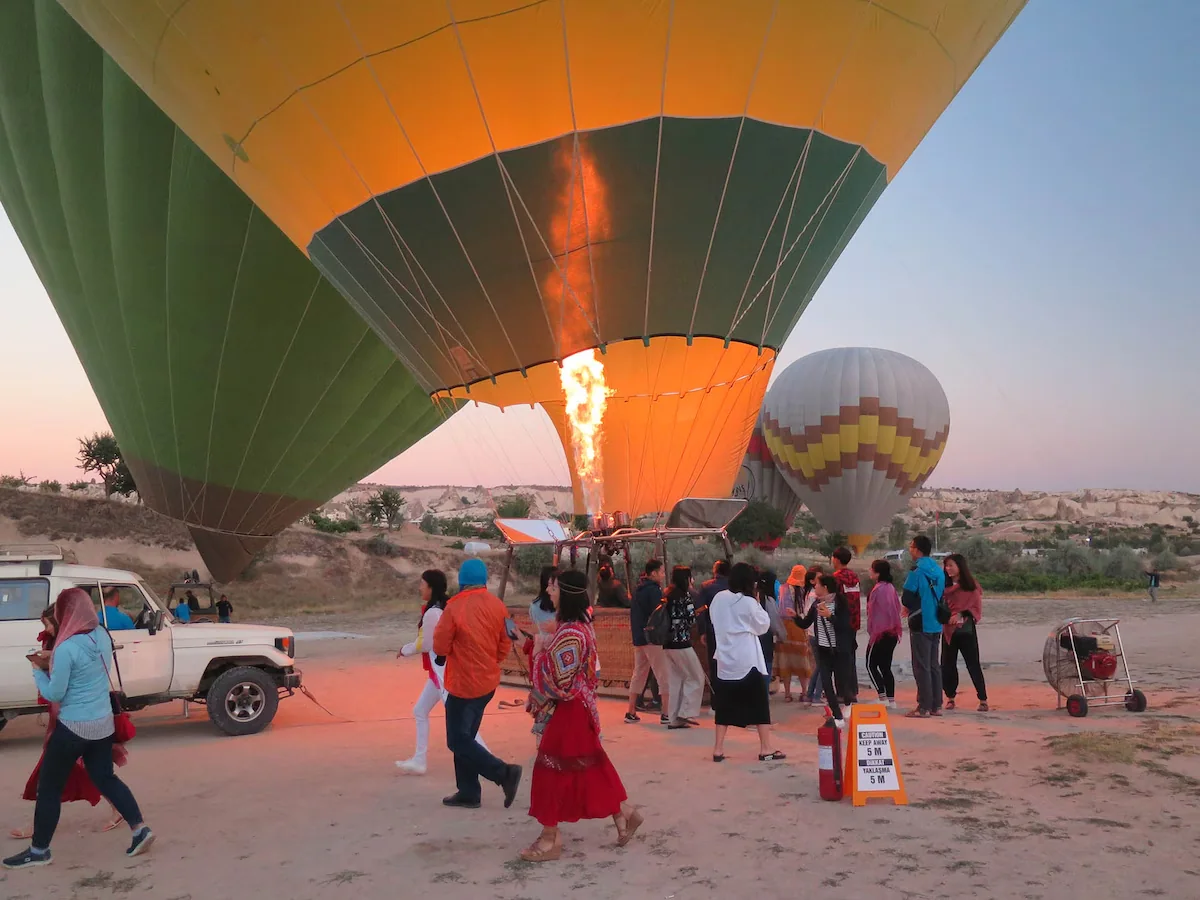 Hot air balloon inflation before sunrise in Cappadocia