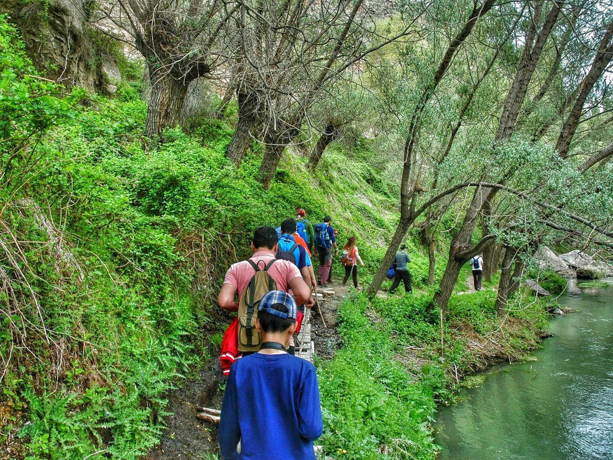 Guests hiking beside the river in Ihlara Valley on a private Cappadocia Green Tour