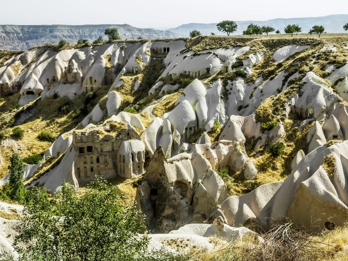 Panoramic view of cave houses and fairy chimneys in Pigeon Valley on a private Cappadocia Green Tour