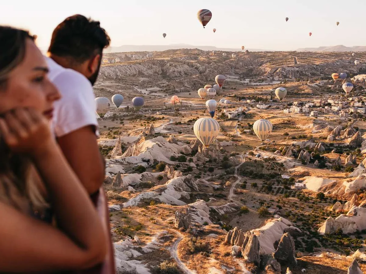 Romantic hot air balloon view over Cappadocia valleys