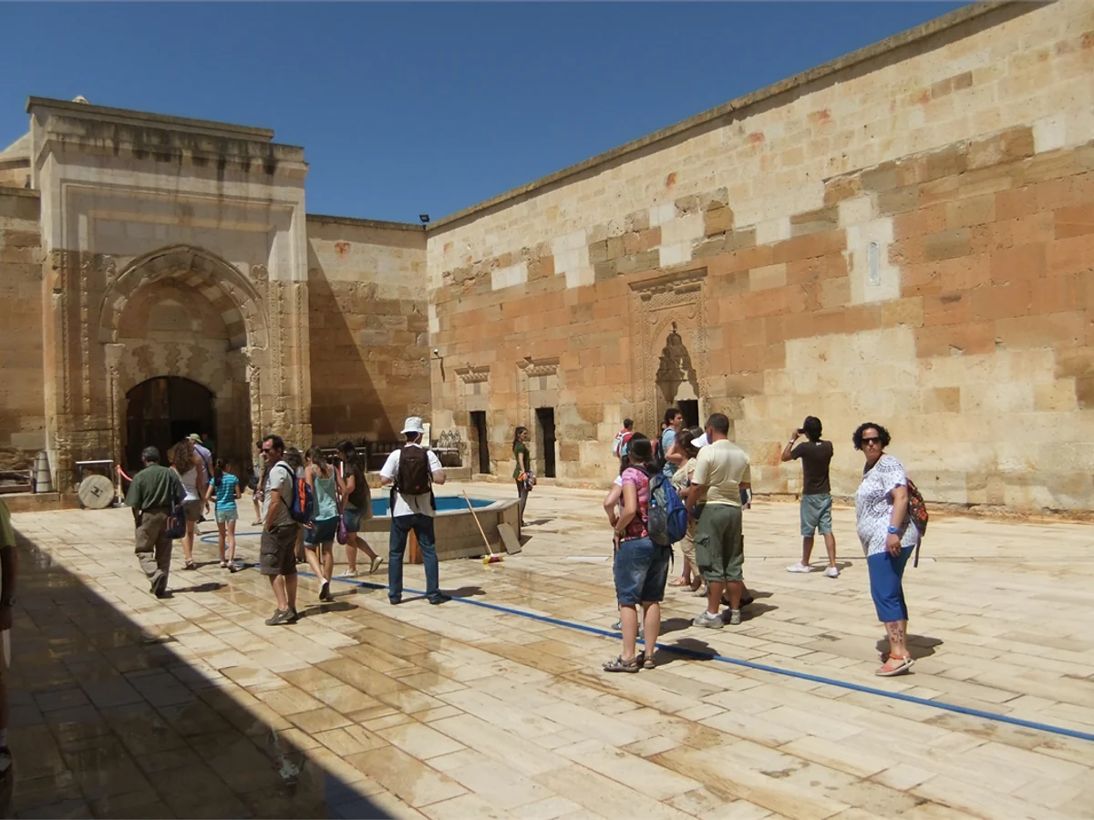 Visitors arriving at Saruhan Caravanserai for a whirling dervish ceremony in Cappadocia