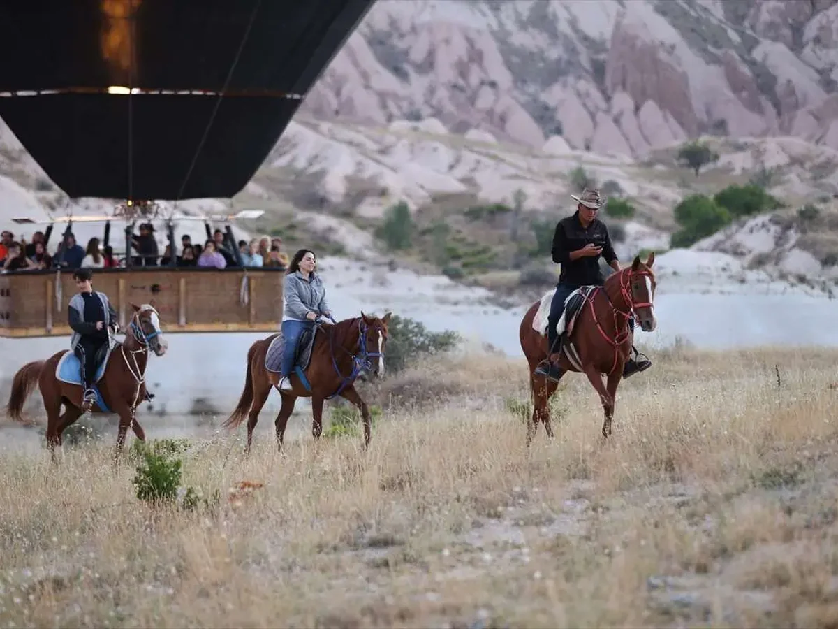Scenic sunrise horse riding safari through the valleys of Cappadocia