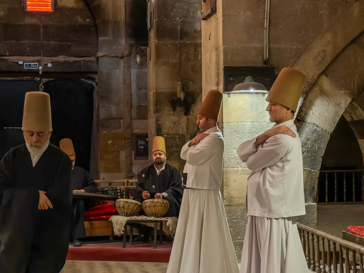 Whirling dervishes and traditional musicians performing a Sema ceremony in Cappadocia